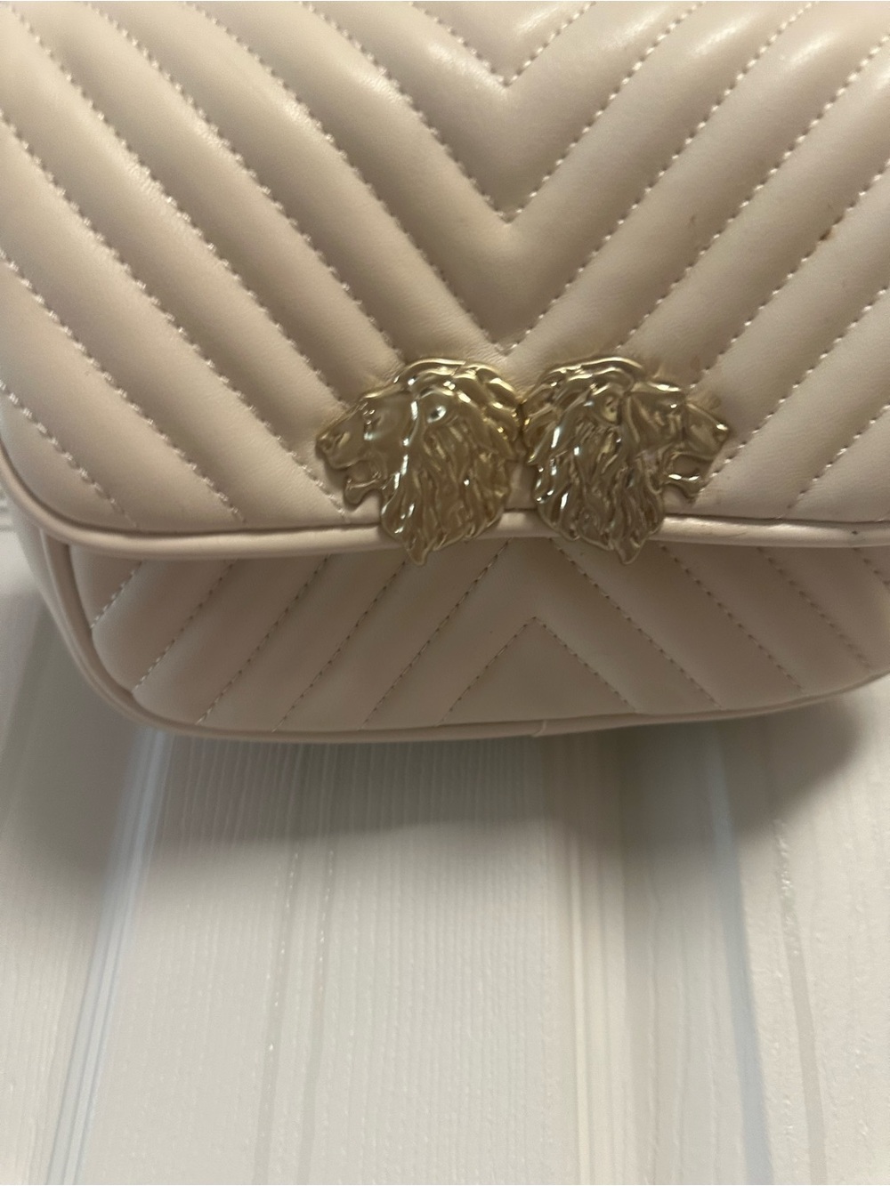 Women’s Quilted Cream Crossbody Bag with Gold Lion Detail